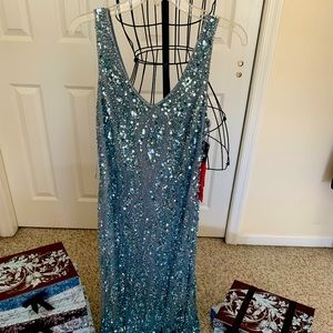 Sleek-styled, sleeveless ice blue beaded gown —never worn. Tags still on.